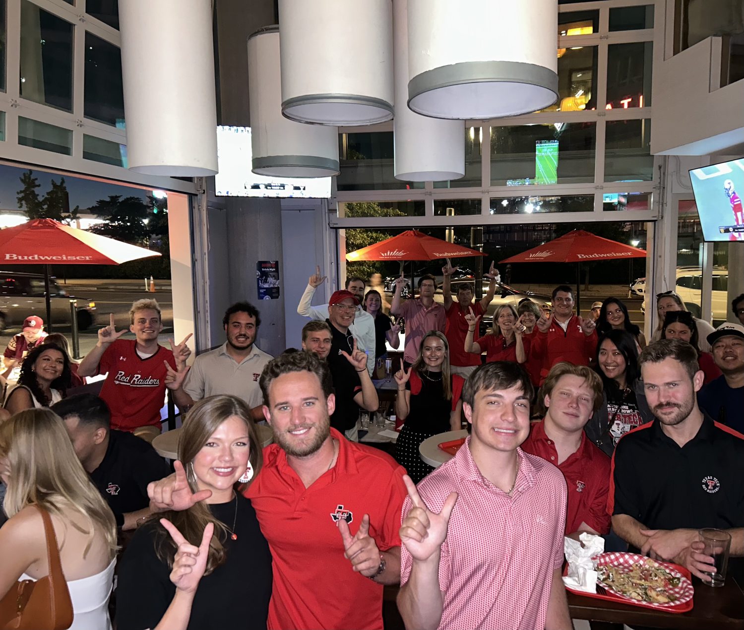 Regulars celebrating at the bar