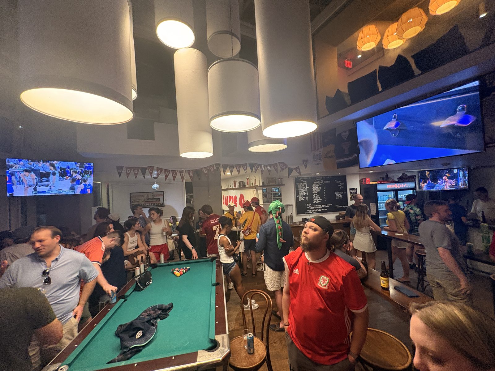 Match day crowd around the pool table at Suzie Q's